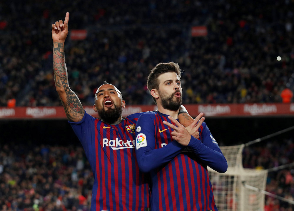 Barcelonau00e2u20acu2122s Gerard Pique celebrates scoring their first goal with Arturo Vidal during their La Liga match with Rayo Vallecano at Camp Nou in Barcelona March 9, 2019. u00e2u20acu201d Reuters pic