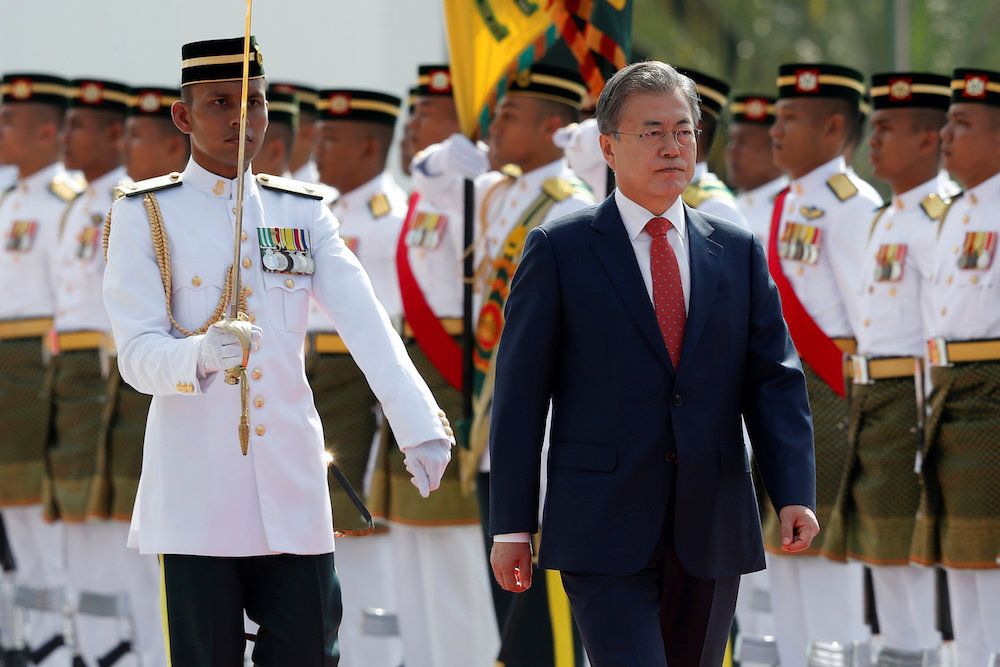 South Korean President Moon Jae-in inspects an honour guard during a state welcoming ceremony at the Parliament Square in Kuala Lumpur March 13, 2019. u00e2u20acu201d Reuters pic