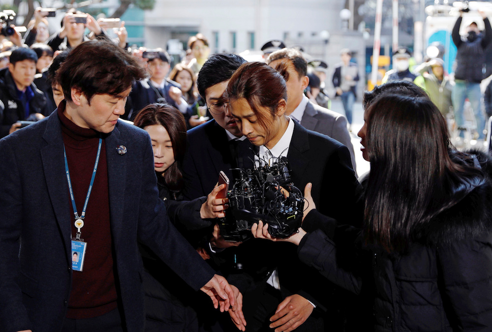 South Korean singer Jung Joon-young arrives for questioning on accusations of illicitly taping and sharing sex videos on social media, at the Seoul Metropolitan Police Agency in Seoul March 14, 2019. — Reuters pic