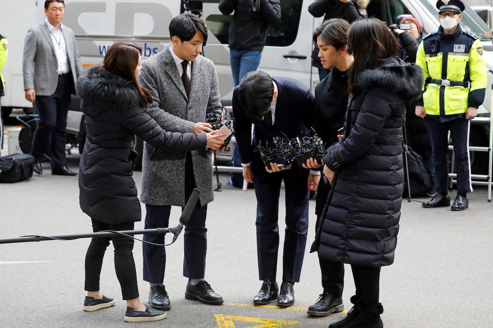 Seungri arrives to be questioned over a sex bribery case at the Seoul Metropolitan Police Agency in Seoul March 14, 2019. — Reuters pic