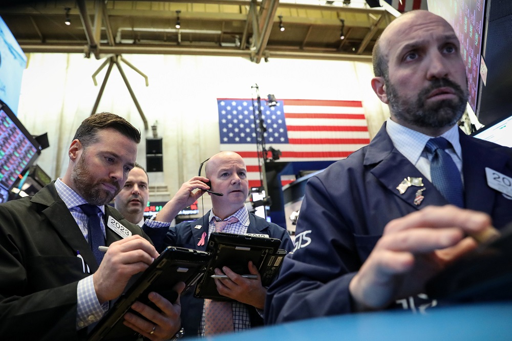Traders work on the floor at the New York Stock Exchange March 22, 2019. u00e2u20acu201d Reuters pic