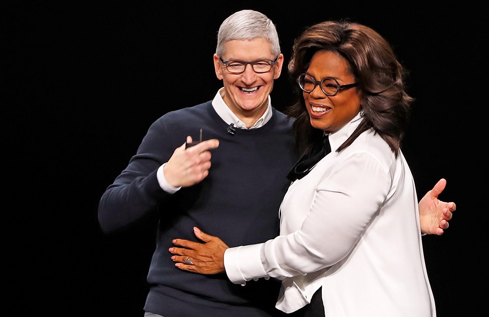 Tim Cook, CEO of Apple (left) and Oprah Winfrey hug during an Apple special event at the Steve Jobs Theater in Cupertino, California March 25, 2019. u00e2u20acu201d Reuters pic