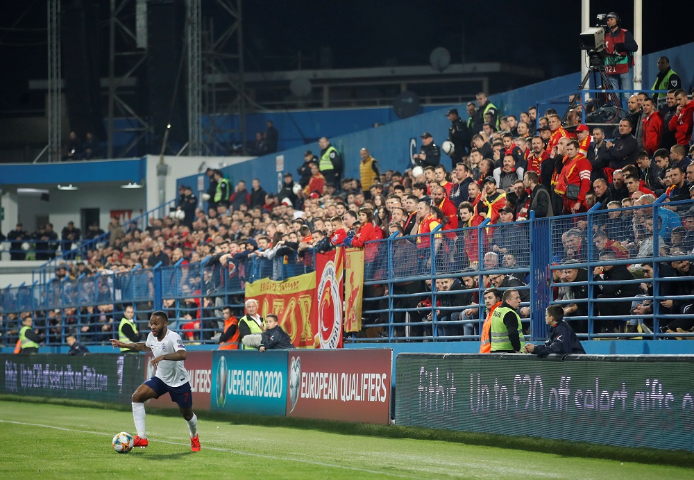 England's Raheem Sterling and Montenegro fans during the match at Podgorica City Stadium in Montenegro March 25. 2019. u00e2u20acu201d Action Images via Reuters