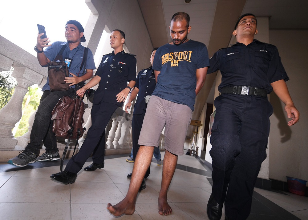 G.Thinathayaalan (second right) is brought to the Sessions Court in Kuala Lumpur March 1, 2019. u00e2u20acu201d Bernama pic