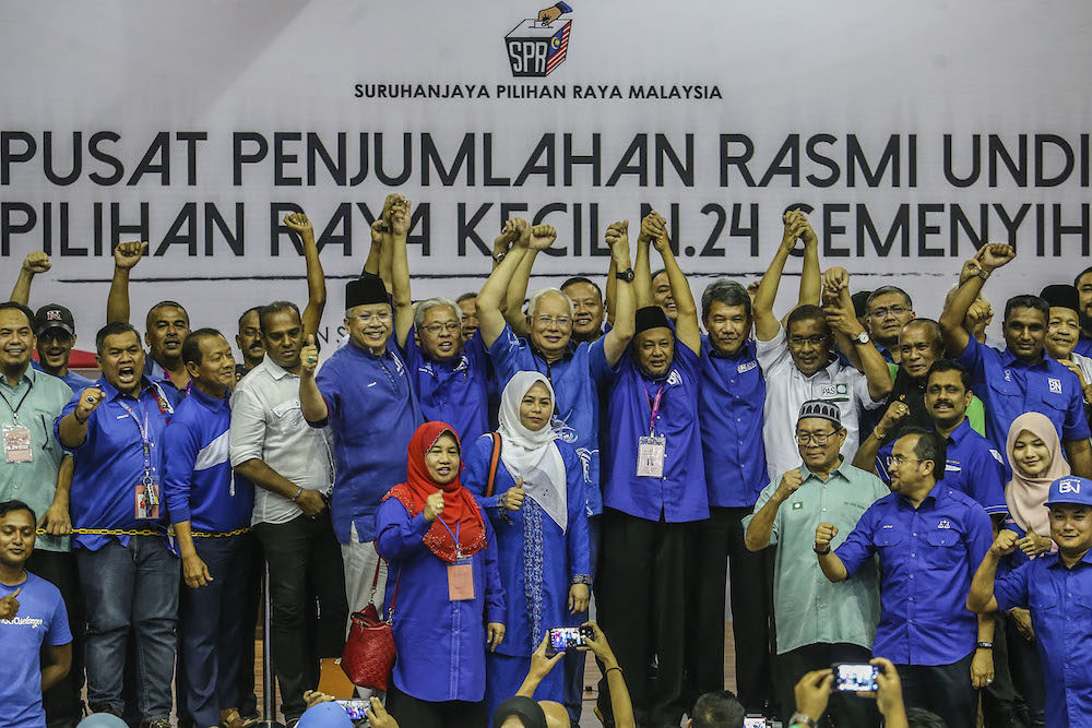 Senior Barisan Nasional leaders and Semenyih candidate Zakaria Hanafi (centre) celebrate on stage after the party was announced the winner in the Semenyih by-election March 2, 2019. u00e2u20acu201d Picture by Hari Anggara.nn