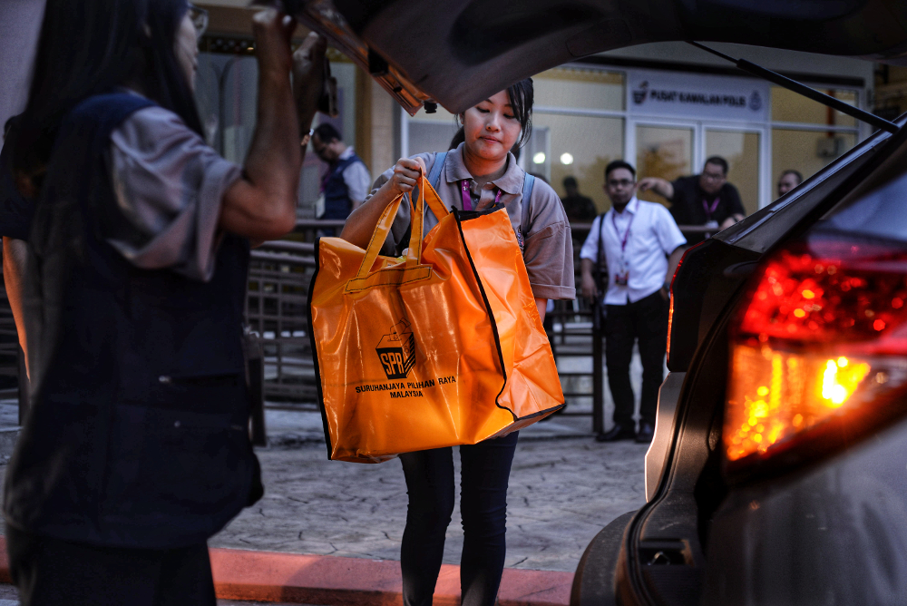 Ballot boxes for the Semenyih by-election arrive at the Dewan Seri Cempaka counting centre after polling closed in Semenyih March 2, 2019. u00e2u20acu201d Picture by Shafwan Zaidon 