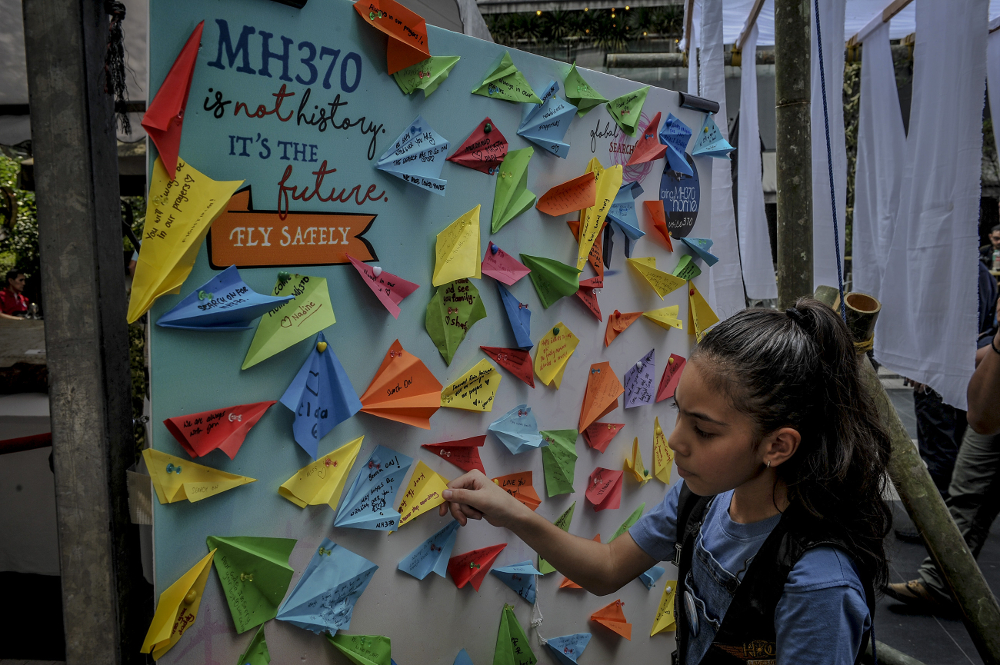 Messages written on paper planes are displayed during the remembrance ceremony to mark the 5th anniversary of MH370u00e2u20acu2122s disappearance in Kuala Lumpur March 3, 2019. u00e2u20acu201d Picture by FIrdaus Latif 