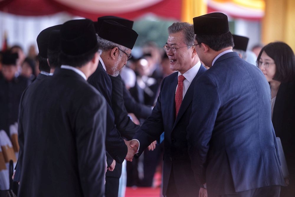 South Korean President Moon Jae-in greets MPs during a state welcoming ceremony at the Parliament Square in Kuala Lumpur March 13, 2019. — Picture by Shafwan Zaidon