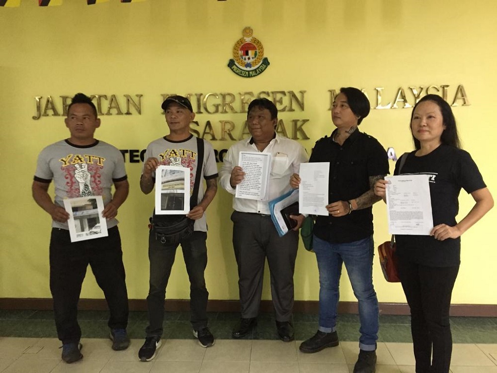 YATTSS president James Francis Noew (centre) with other members after handing over of letter to the Immigration director Datuk Ken Leben, March 14, 2019. u00e2u20acu201d Picture courtesy of Lina Soo.