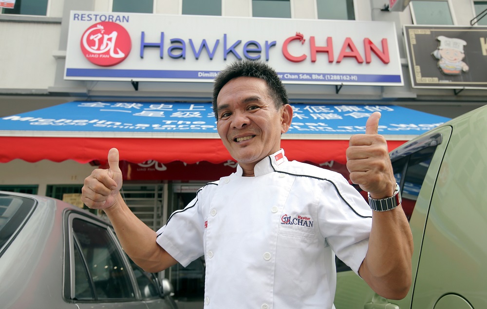 Chan Hon Meng outside the first Malaysian outpost of Liao Fan Hawker Chan in his hometown of Ipoh. u00e2u20acu201d Picture by Farhan Najib 