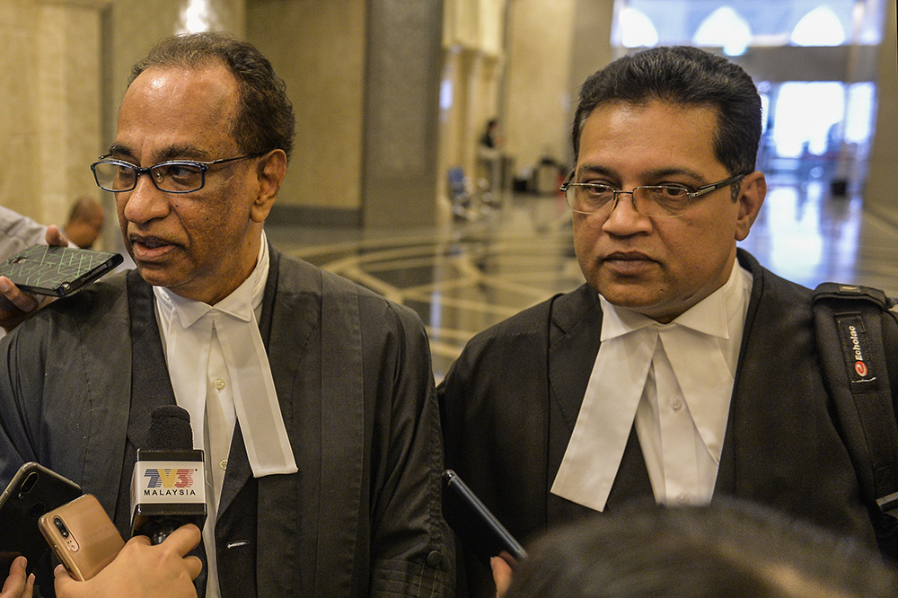 Ad hoc prosecutor, Datuk V. Sithambaram, and Attorney General’s Chambers’ prosecution division head, Manoj Kurup, speak to reporters at the Putrajaya High Court March 21, 2019. — Picture by Miera Zulyana