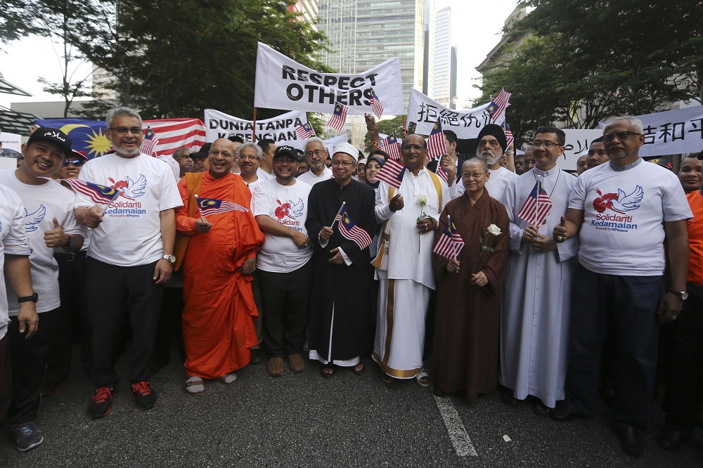 Minister in the Prime Ministeru00e2u20acu2122s Department, Datuk Seri Mujahid Yusof Rawa, and other religious leaders march to Dataran Mardeka during the Solidarity 4 Peace Rally in Kuala Lumpur March 23, 2019. u00e2u20acu201d Picture by Yusof Mat Isa