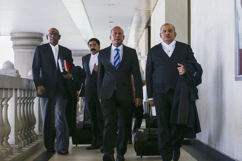 Former Asian International Centre for Arbitrationu00e2u20acu2122s (AIAC) director Datuk Sundra Rajoo Nadarajah (centre) leaves the Sessions Court in Kuala Lumpur March 26, 2019. u00e2u20acu201d Picture by Hari Anggara