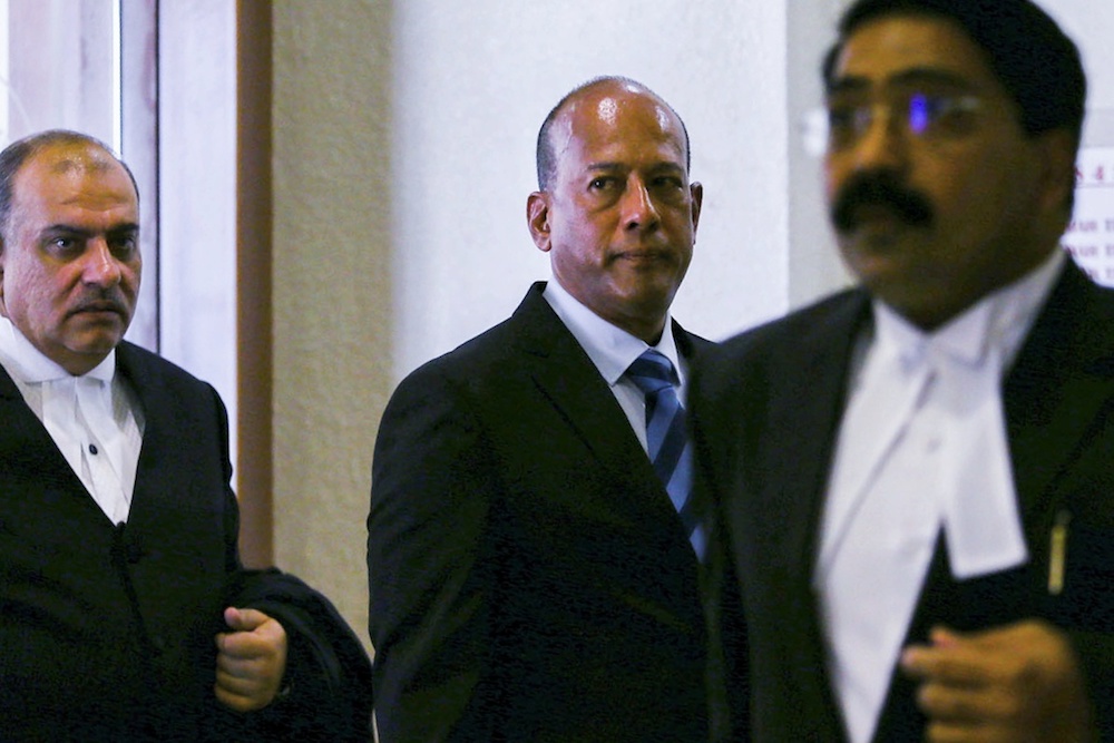 Former Asian International Centre for Arbitrationu00e2u20acu2122s (AIAC) director Datuk Sundra Rajoo Nadarajah (centre) leaves the Sessions Court in Kuala Lumpur March 26, 2019. u00e2u20acu201d Picture by Hari Anggara
