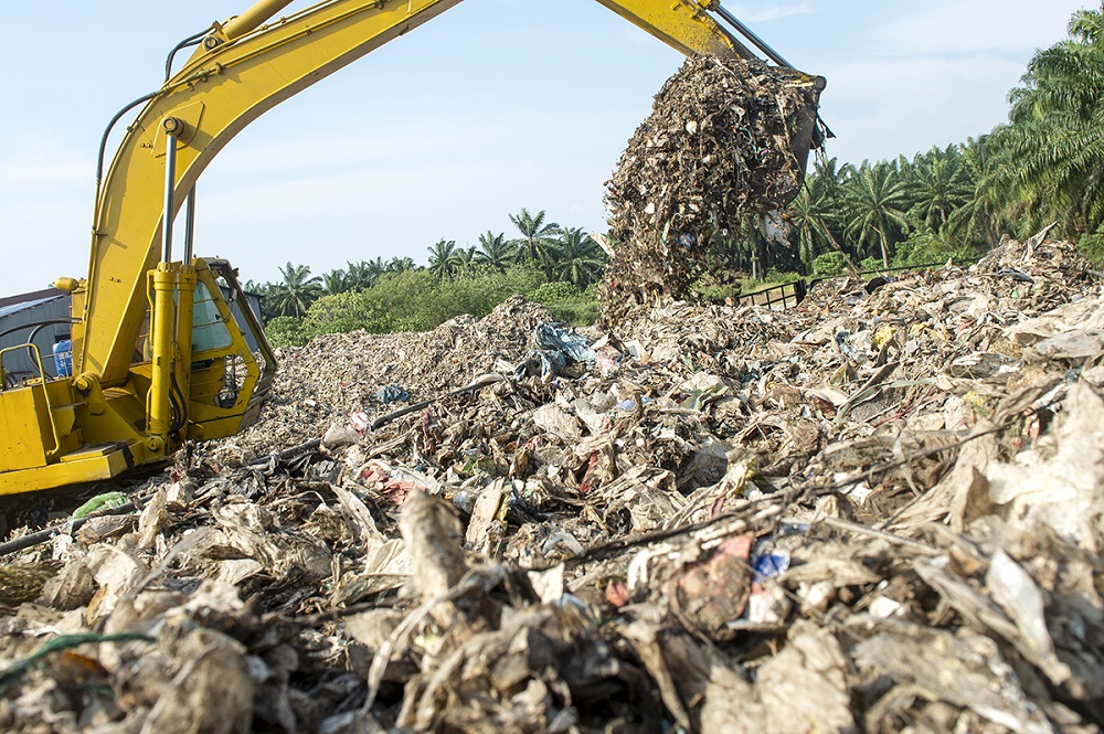 An excavator is seen clearing piles of plastic at an illegal recycling site in Jenjarom, Banting March 26, 2019. u00e2u20acu201d Picture by Mukhriz Hazim