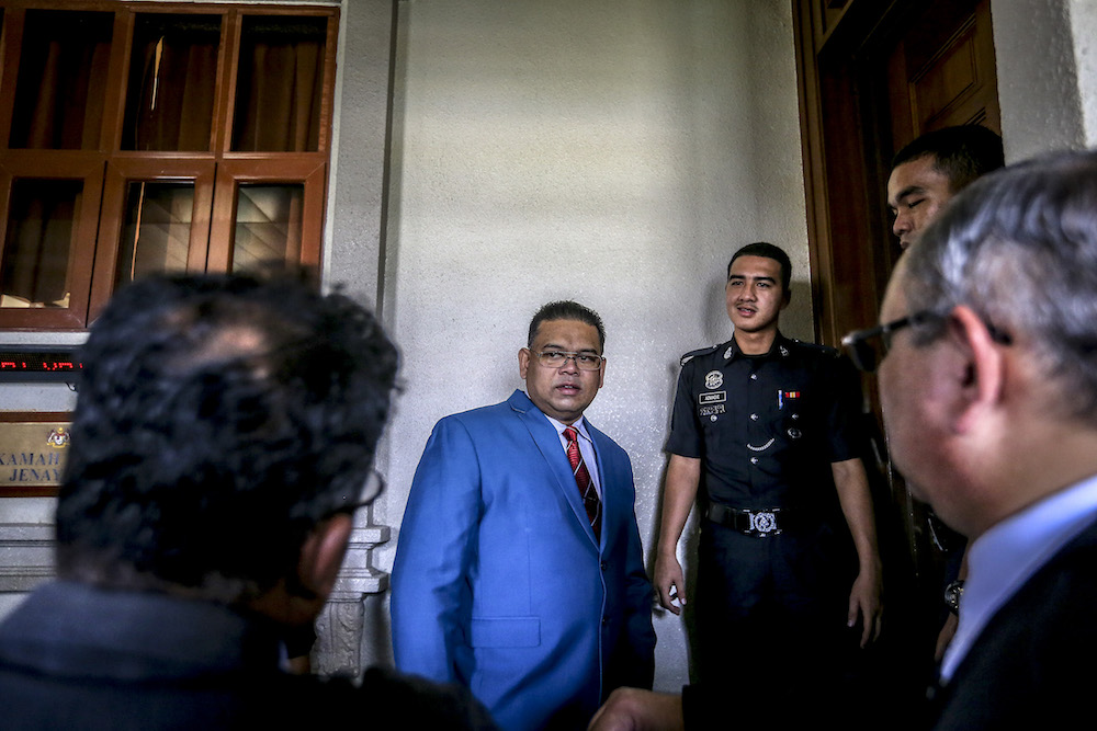 Datuk Lokman Noor Adam waits outside a courtroom at the Kuala Lumpur Court Complex March 28, 2019. u00e2u20acu201d Picture by Firdaus Latif