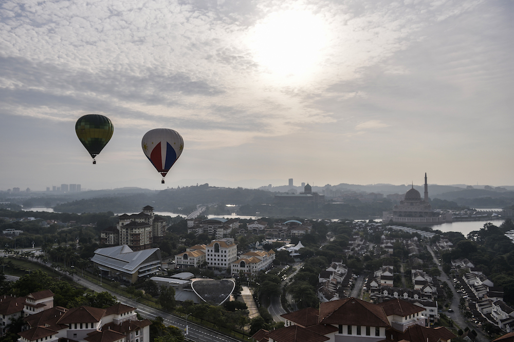Hot air balloons soar in the skies above Putrajaya during the International Hot Air Balloon Fiesta March 28, 2018. u00e2u20acu201d Picture by Miera Zulyana