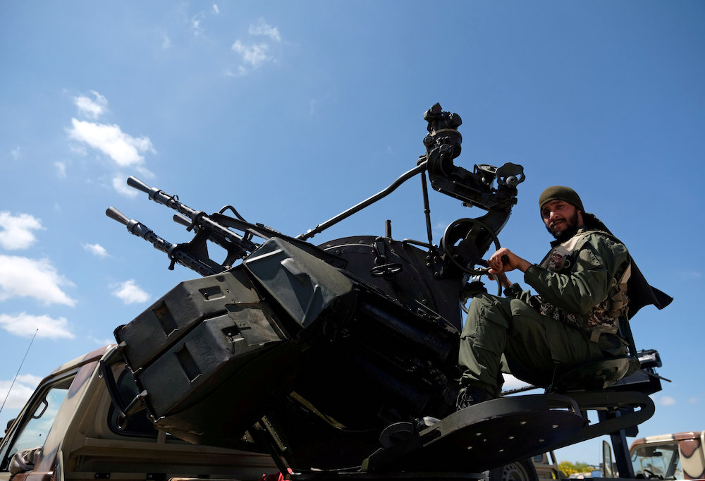 A member of Libyan National Army (LNA), commanded by Khalifa Haftar, is seen as he heads out of Benghazi to reinforce the troops advancing to Tripoli, in Benghazi April 7, 2019. u00e2u20acu201d Reuters picnn
