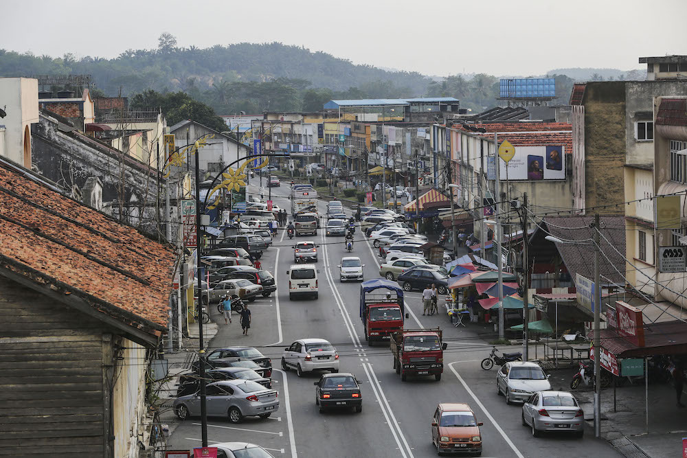 Residents go about their daily activities in the town of Rantau, March 29, 2019. u00e2u20acu201d Picture by Yusof Mat Isa