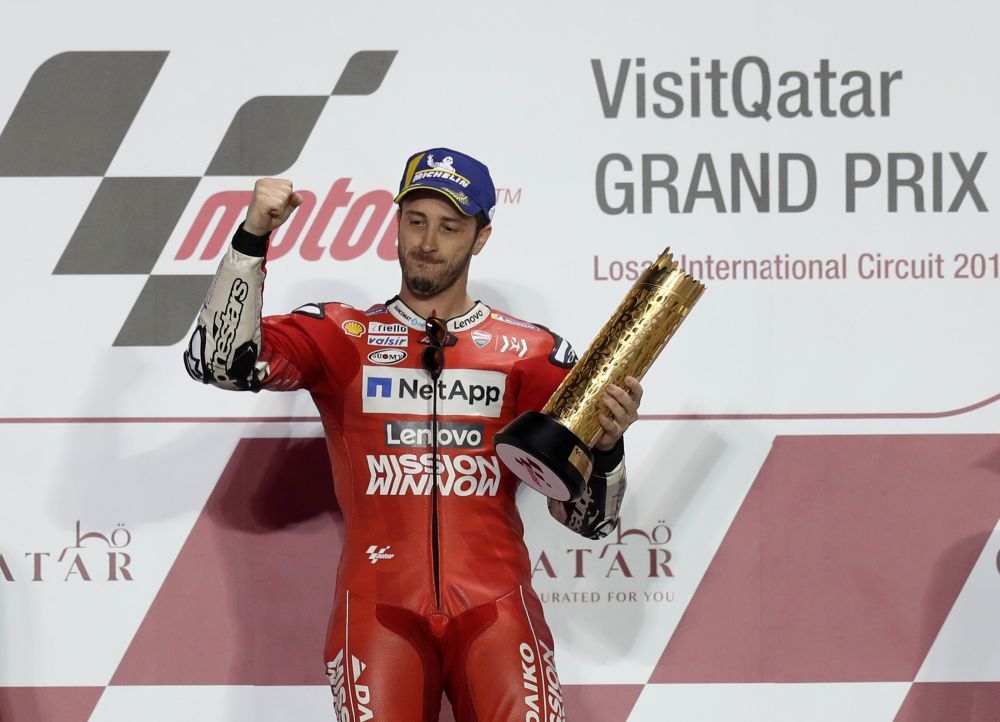 Mission Winnow Ducati's Andrea Dovizioso celebrates with a trophy on the podium after winning the race. u00e2u20acu201d Reuters pic