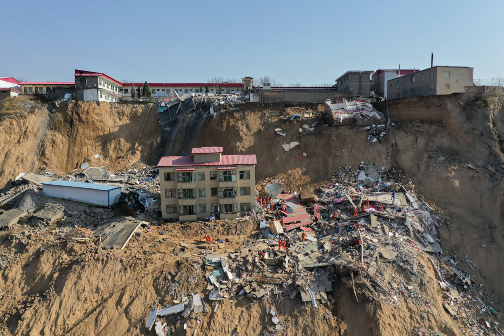 This photo taken on March 16, 2019 shows rescuers working at the site of a landslide in Xiangning county in Linfen city in Chinau00e2u20acu2122s northern Shanxi province. u00e2u20acu201d AFP pic