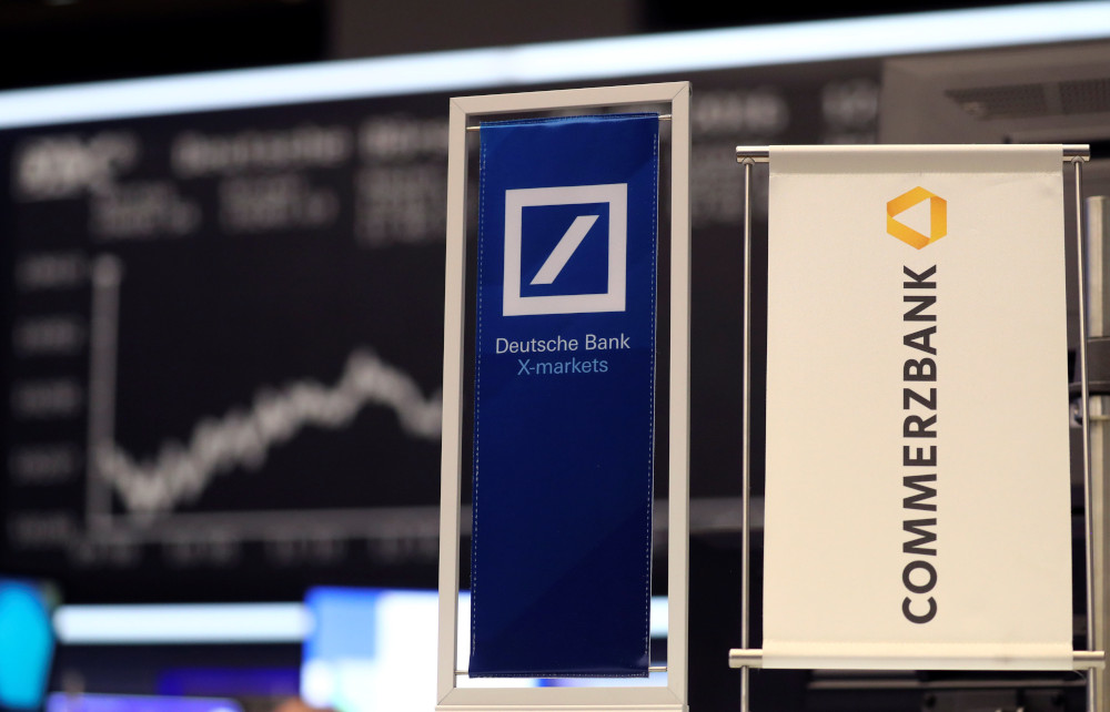 Banners of Deutsche Bank and Commerzbank are pictured in front of the German share price index, DAX board, at the stock exchange in Frankfurt, Germany, September 30, 2016. u00e2u20acu201d Reuters  pic