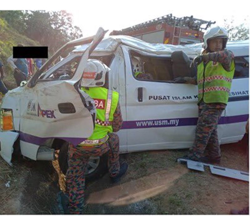 Fire and Rescue Department personnel are seen at the scene of the accident in this picture taken from social media. u00e2u20acu201d Picture via Twitter/Bernamadotcom
