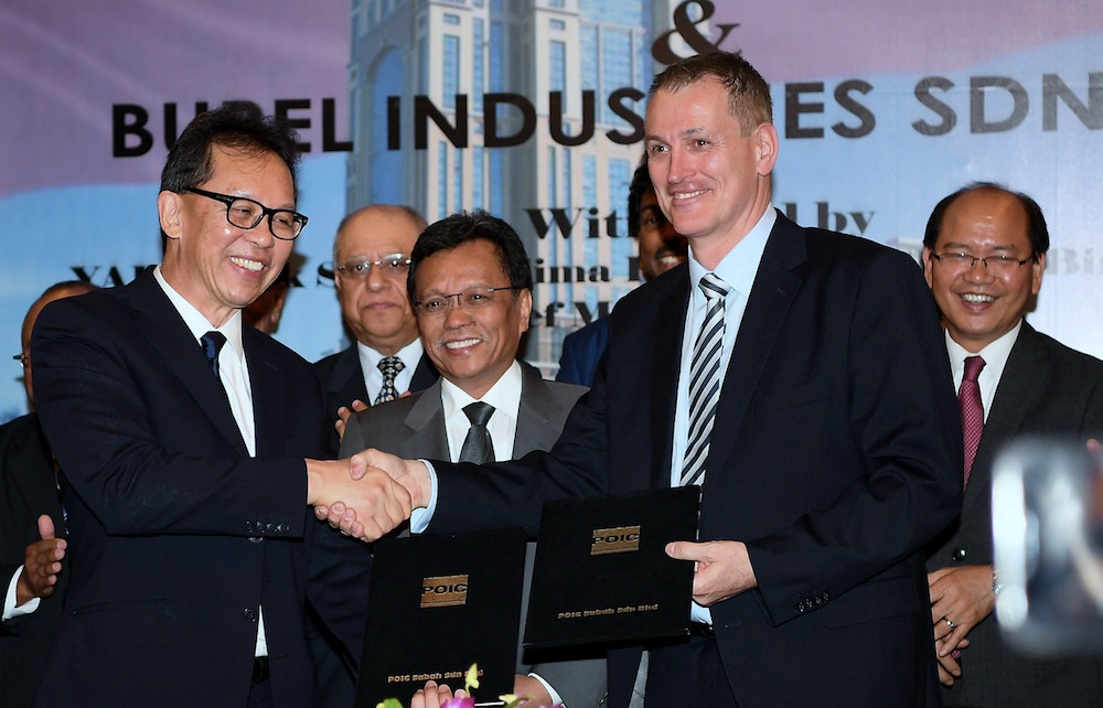 Chief Minister Datuk Seri Mohd Shafie Apdal witnesses the signing ceremony between POC Sabah CEO Datuk Pang Teck Wai and Burel Industries executive chairman Per N. Brandtzag in Kota Kinabalu March 6, 2019. u00e2u20acu201d Bernama pic
