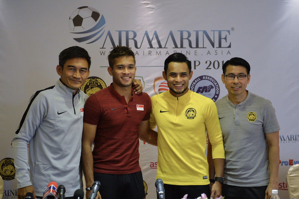 Singapore coach Nazri Nasir, Singapore captain Zulfahmi Arifin, Harimau Malaya captain Zaquan Adha and Harimau Malaya coach Tan Cheng Hoe pose for pictures at the press conference for the Airmarine Cup 2019 in Subang Jaya March 19, 2019. u00e2u20acu201d Bernama pic