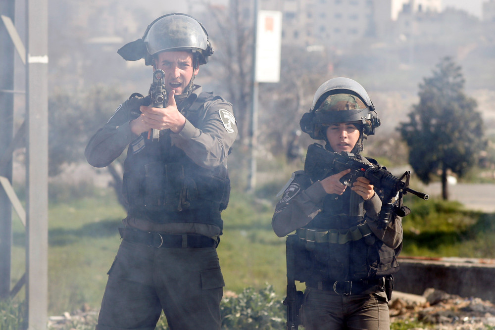 An Israeli border police points his weapon towards journalists and medics during clashes with Palestinian protesters near the Jewish settlement of Beit El, in the Israeli-occupied West Bank March 20, 2019. u00e2u20acu201d Reuters pic