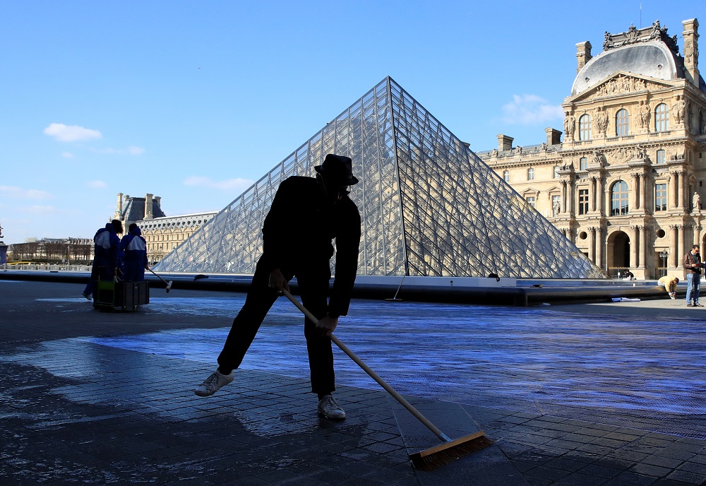 French artist JR works in the courtyard of the Louvre Museum near the glass pyramid designed by I.M. Pei as the Louvre Museum celebrates the 30th anniversary of its glass pyramid in Paris March 26, 2019. u00e2u20acu201d Reuters pic    
