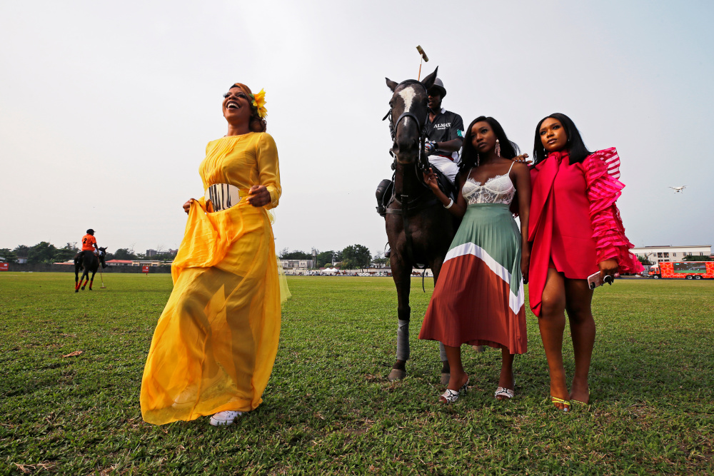Spectators Vonne Nwosu, Ini Okojie and Mimi Onaloja pose with a polo player after a match at the 2019 Lagos International Polo Tournament in Lagos, Nigeria March 17, 2019. u00e2u20acu201d Reuters pic 