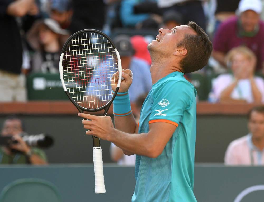 Philipp Kohlschreiber celebrates after winning his third round match to defeat Novak Djokovic (not pictured) in the BNP Paribas Open at the Indian Wells Tennis Garden. u00e2u20acu2022 Picture by Jayne Kamin-Oncea-USA TODAY Sports via Reuters