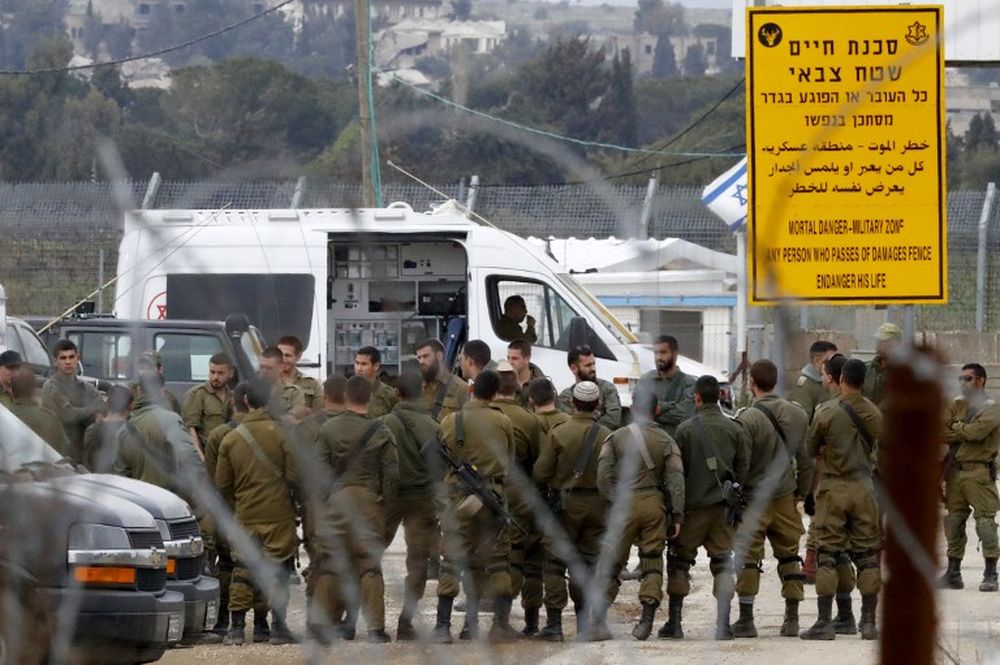 Israeli soldiers stand guard at the Quneitra border crossing of the Israeli annexed-Golan Heights, on March 23, 2019. u00e2u20acu201d AFP pic