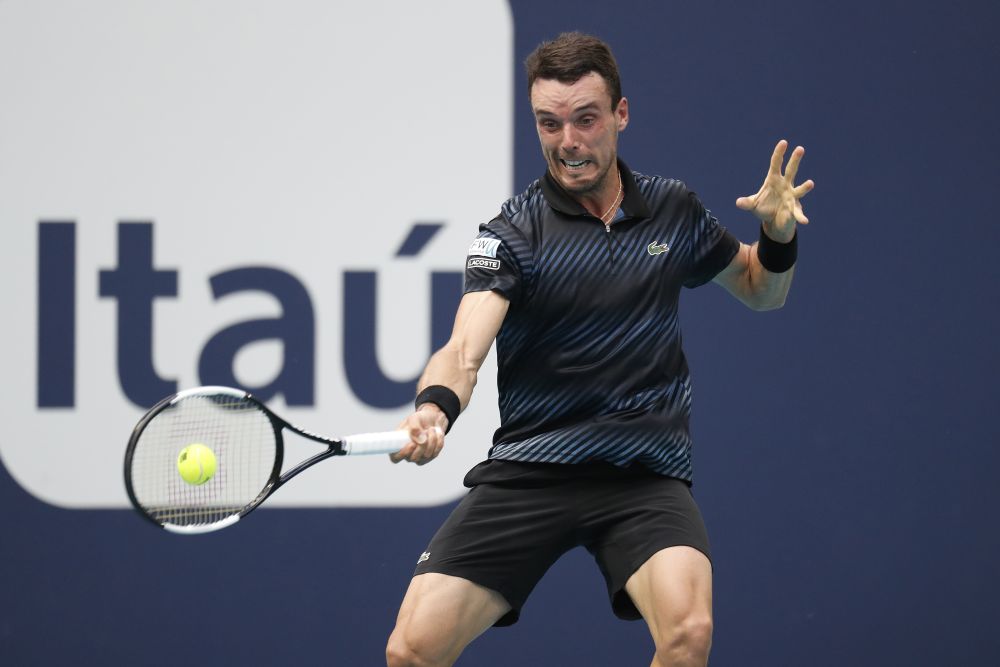 Roberto Bautista Agut hits a forehand against Novak Djokovic in the fourth round of the Miami Open at Miami Open Tennis Complex. u00e2u20acu201d Reuters pic
