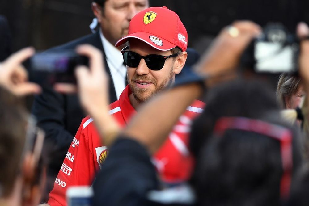 Ferrariu00e2u20acu2122s German driver Sebastian Vettel greets fans during an F1 live event to introduce drivers and team principals in Melbourne on March 13, 2019, ahead of the Formula One Australian Grand Prix. u00e2u20acu201d AFP pic