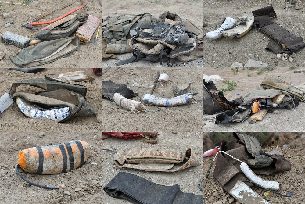 This combination of pictures created on March 24, 2019 shows an assortment of improvised explosive devices and explosive belts lying on the ground in the village of Baghouz in Syriau00e2u20acu2122s eastern Deir Ezzor province near the Iraqi border. u00e2u20acu201d AFP pic