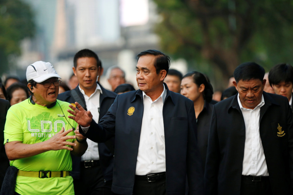 Thailandu00e2u20acu2122s Prime Minister Prayut Chan-o-cha talks with a man as he visits Lumphini Park ahead of the general election, in Bangkok, Thailand, March 20, 2019. u00e2u20acu201d Reuters pic
