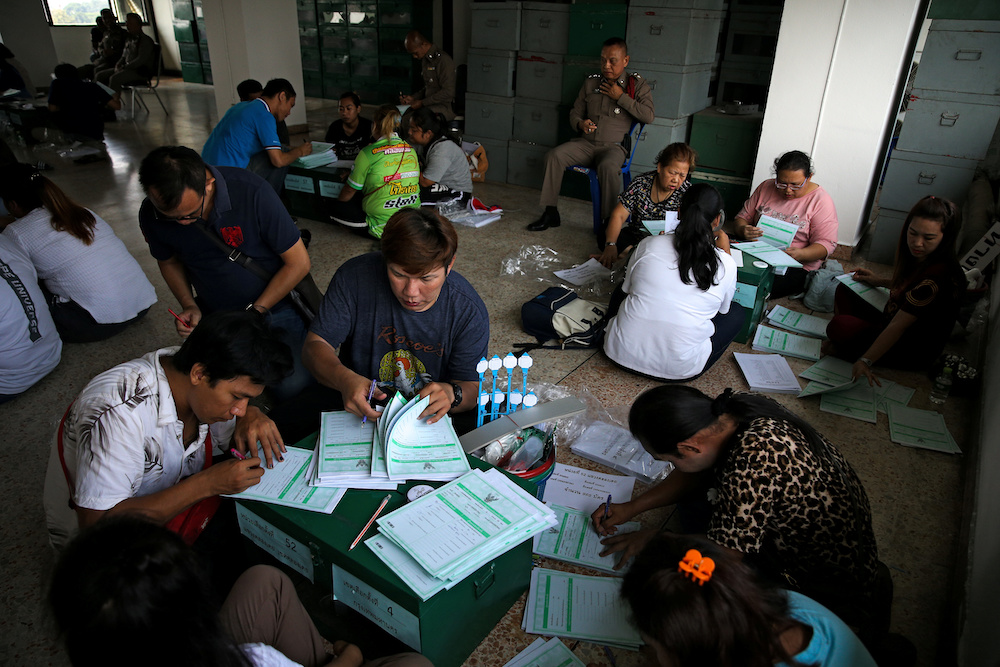 Bangkok district officers and police officers prepare ballot boxes and other documents ahead of the general election at a local district office in Bangkok, Thailand, March 23, 2019. u00e2u20acu201d Reuters picnn