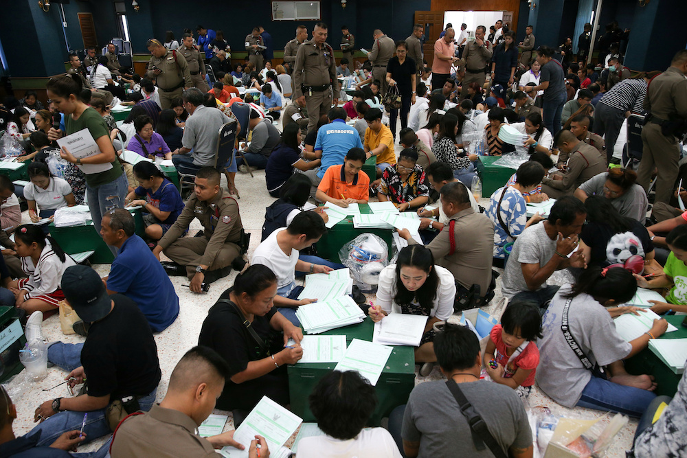 Bangkok district officers and police officers prepare ballot boxes and other documents ahead of the general election at a local district office in Bangkok, Thailand, March 23, 2019. u00e2u20acu201d Reuters picnn