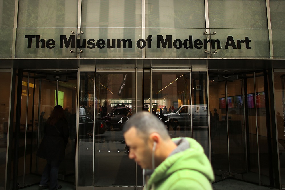 In this file photo taken on April 11, 2013 a man walks by the Museum of Modern Art (MoMA) in New York City. u00e2u20acu2022 AFP pic 