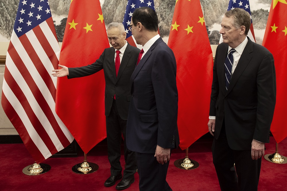 China's Vice Premier Liu He (left) gestures after posing for a photo with US Treasury Secretary Steven Mnuchin (centre) and US Trade Representative Robert Lighthizer at Diaoyutai State Guesthouse in Beijing March 29, 2019. u00e2u20acu2022 AFP pic