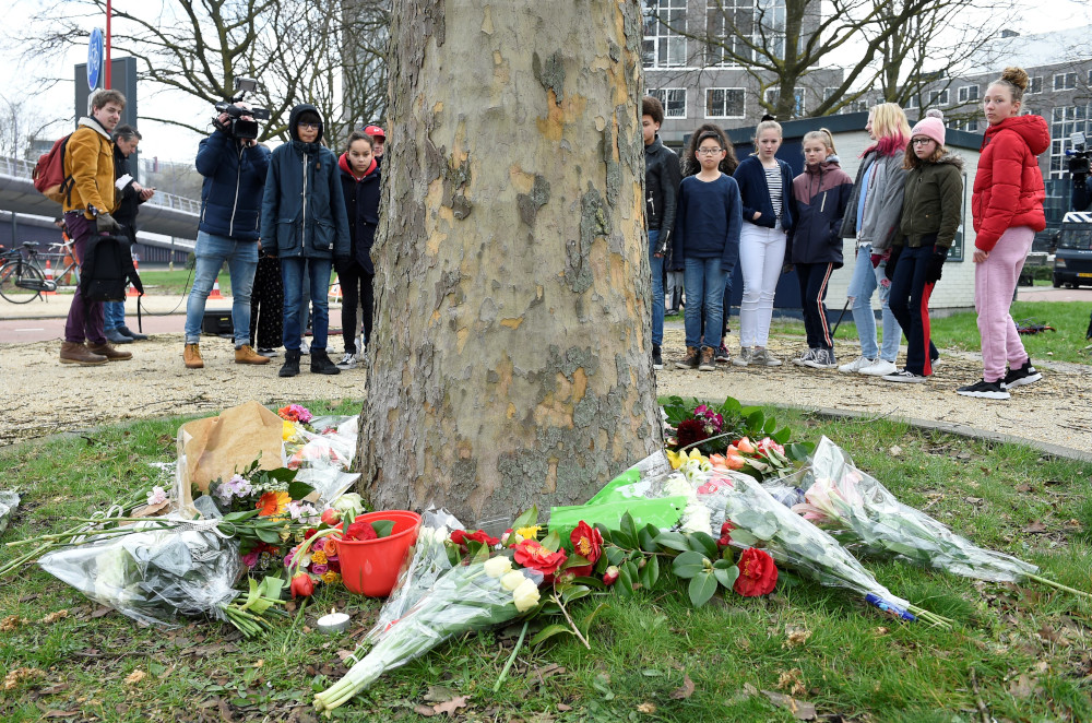 Teenagers lay flowers at the site of a shooting in a tram, at 24 October square in Utrecht, the Netherlands, March 19, 2019, one day after three people were shot dead and several were injured in the attack. u00e2u20acu201d AFP pic 