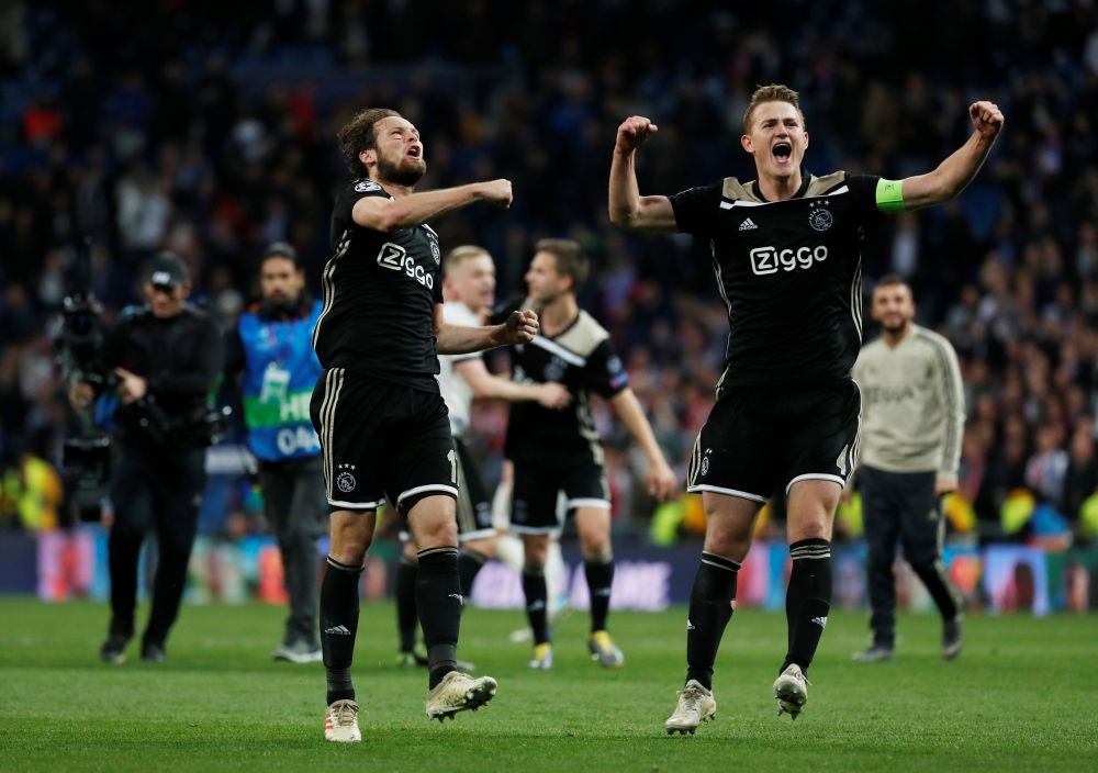 Ajax's Daley Blind and Matthijs de Ligt celebrate at the end of the match against Real Madrid, March 5, 2019. u00e2u20acu2022 Reuters pic