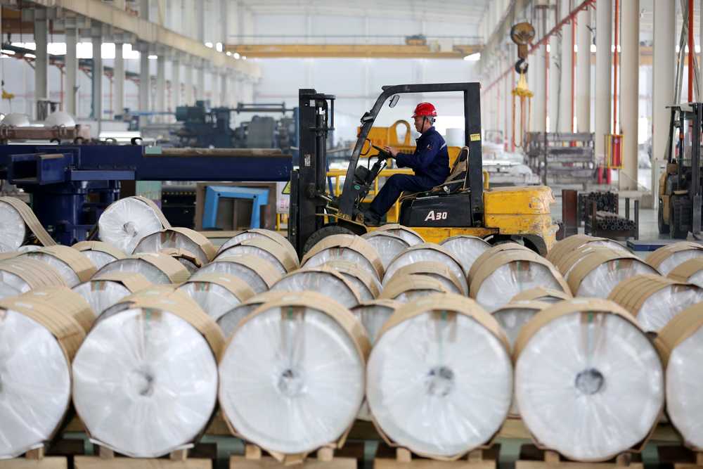 A worker drives a forklift past aluminum rolls at a factory in Huaibei, Anhui province, China March 2, 2019. u00e2u20acu201d Reuters pic