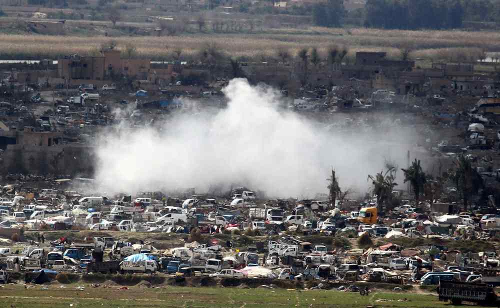 Smoke rises from the last besieged neighborhood in the village of Baghouz, Deir Al Zor province, Syria March 17, 2019. u00e2u20acu201d Reuters pic