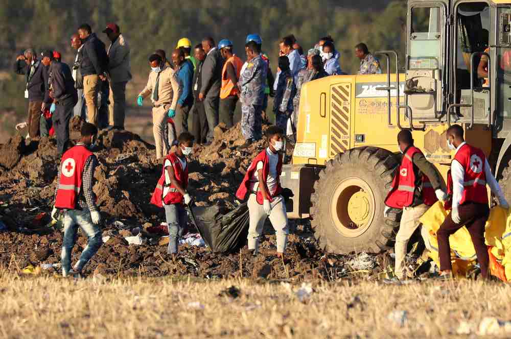 Members of the search and rescue mission carry dead bodies at the scene of the Ethiopian Airlines Flight ET 302 plane crash, near the town of Bishoftu, southeast of Addis Ababa, Ethiopia March 10, 2019. u00e2u20acu201d Reuters pic