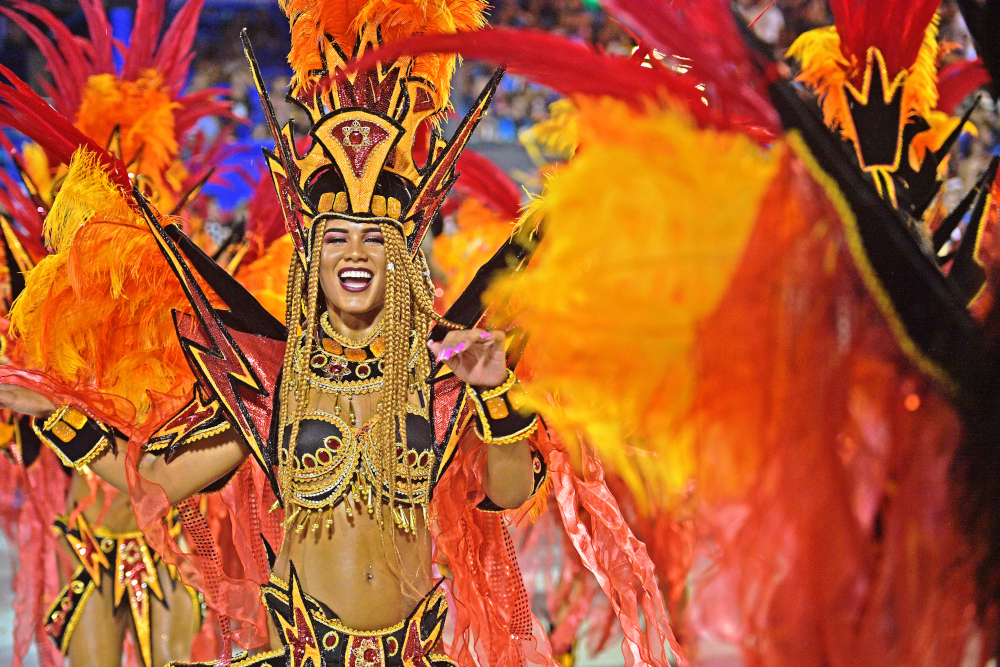 A member of the u00e2u20acu02dcGrande Riou00e2u20acu2122 samba school performs during the first night of Riou00e2u20acu2122s Carnival at the Sambadrome in Rio de Janeiro, Brazil, early on March 4, 2018. u00e2u20acu201d AFP pic