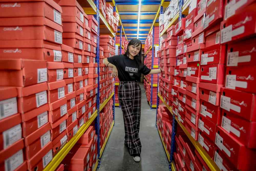 Stack after stack of red boxes fill the warehouses at the Christy Ng office in Petaling Jaya. u00e2u20acu201d Picture by Firdaus Latif
