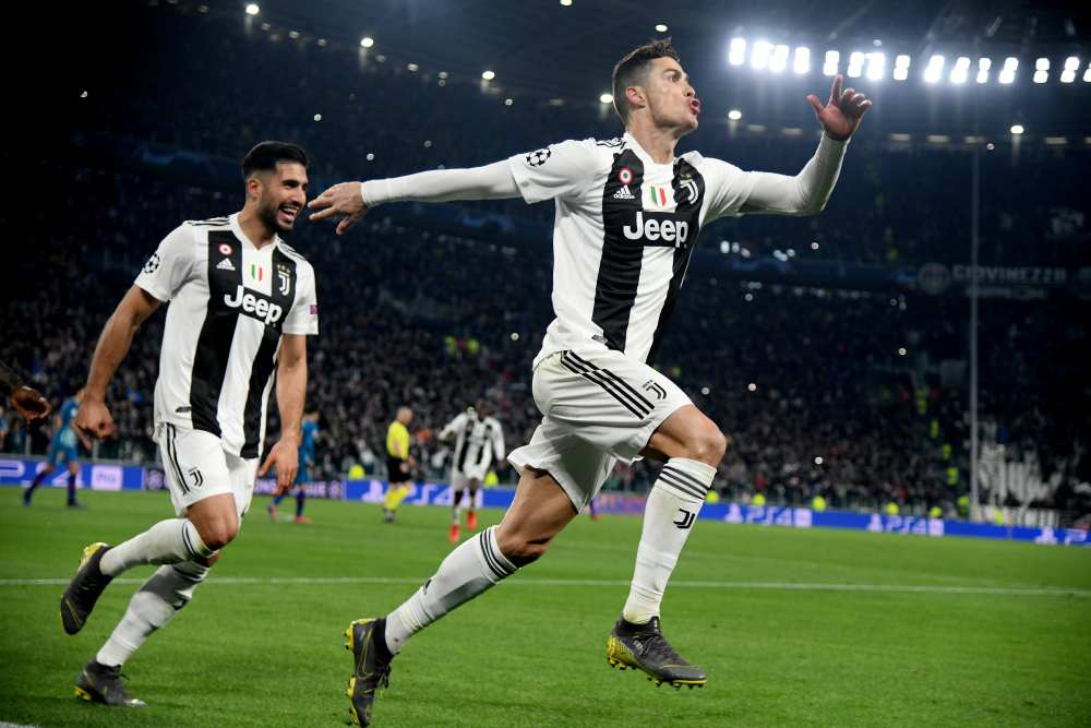 Juventusu00e2u20acu2122 Cristiano Ronaldo celebrates scoring their third goal against Atletico Madrid to complete his hat-trick with Emre Can during their Champions League Round of 16 Second Leg match in Allianz Stadium, Turin, March 12, 2019. u00e2u20acu201d Reuters pic